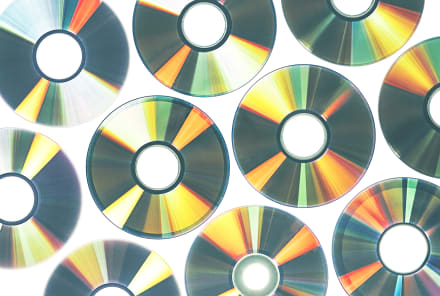 Easy Ways To Recycle Old CDs & DVDs (Because Trashing Them Is A No-No)